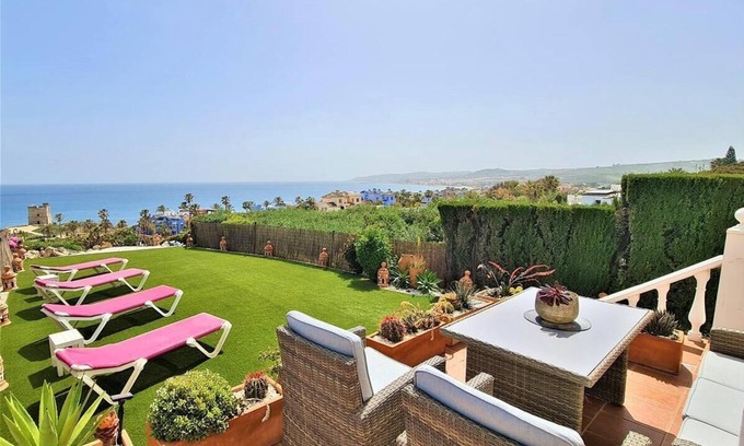 Bahia de Casares House | Stylish townhouse, seaviews, air-con and garden, 10 mins walk to the beach and large communal pool