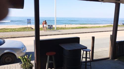 Praia Grande Apartment | Suíte frente mar