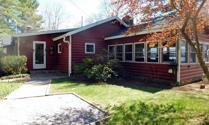 Naples Cottage | Sunset point waterfront home on with lots of outdoor space! Pet-friendly!