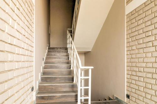 Auli Hotel | Super Townhouse Amaraa Farms Near LuLu Hypermarket