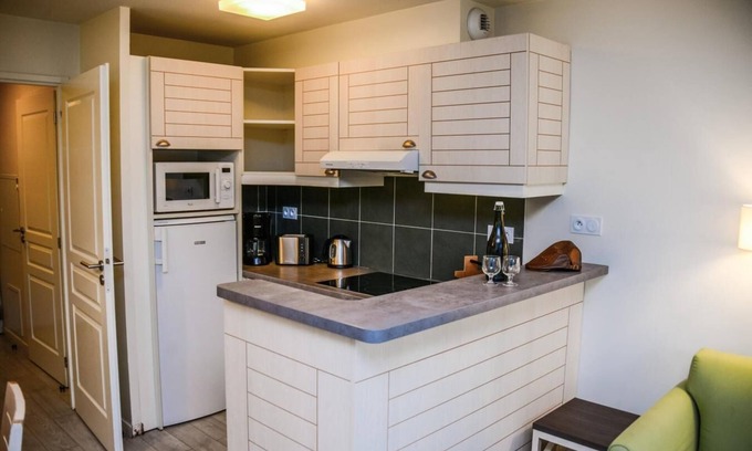 Danestal House | Surface area : about 50 m². Level 0 : Living room with bed-settee. Kitchen with coffee machine