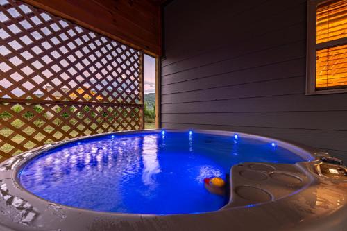 Cosby House | Sweet Mountain Memories Relax affordably cozy cabin with hot tub, game room, and mountain views!