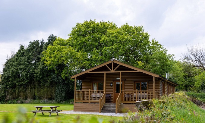 Torrington Cottage | TARKA'S HOLT LOG CABIN, family friendly, with pool in Torrington