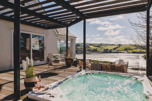 Teignmouth House | The Curlews - Waterside, boutique home with 10 person spa