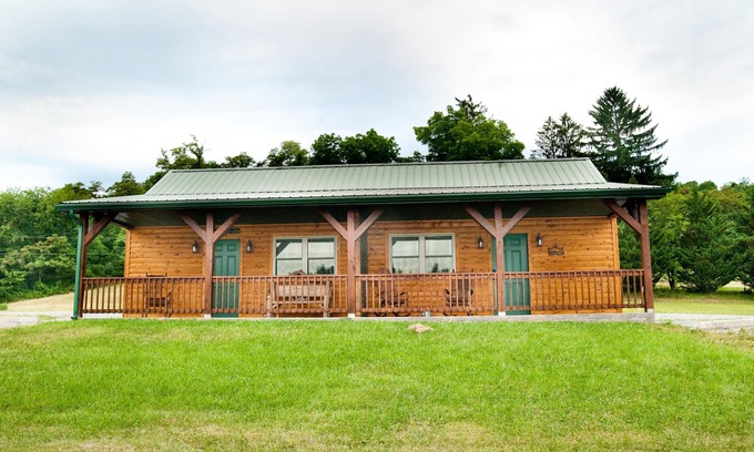 Flintstone Ski Chalet | The double cabin has 2 queen beds, 1 king bed, 1 sleep sofa for 1 child. Cabin has common porch and each unit has a private entrance.