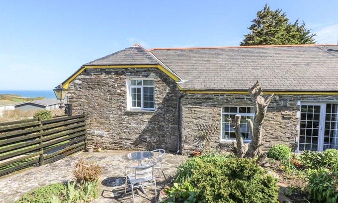 Tintagel Cottage | THE GARDEN APARTMENT, pet friendly, with open fire in Tintagel