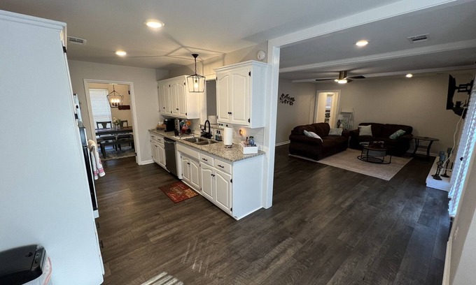 Fort Smith House | The Lily Pad. 3 bd/1ba. 4 beds. Center of town! Fenced backyard!