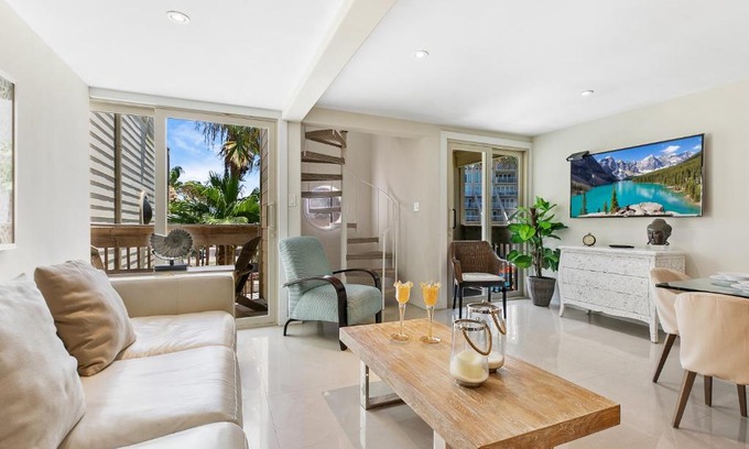 South Padre Island House | The ocean waves are calling! Relaxing setting with pool view in beachfront resort