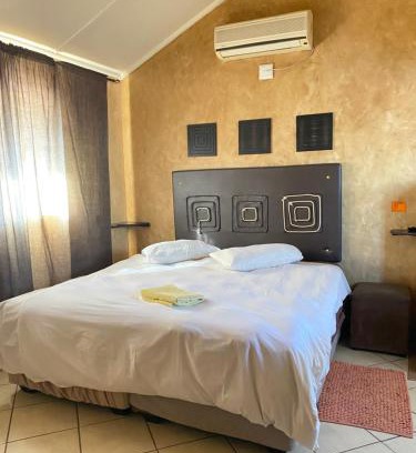 Phalaborwa Apartment | The Orange room