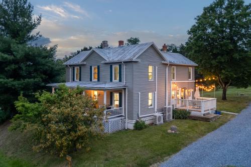 Luray House | The Orchard, a family friendly home- hot tub, fire pit, yard games