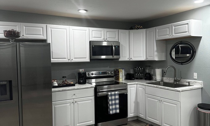 Aurora House | The room has bathroom and king size bed and a shared living room. Super cozy!