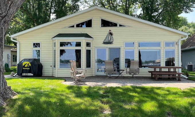 Spirit Lake House | The Yellow House on East Lake! Dock access to bring your boat.