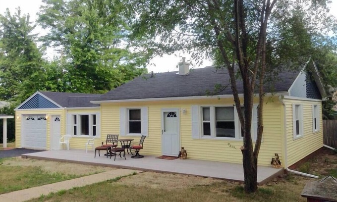 Michigan City Cottage | The Yellow House Near the ShorenWalking distance to Sheridan Beach,