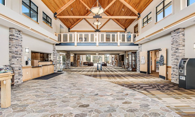Three Lakes Condo | Third-floor studio with lake view, kitchenette, balcony, hot tubs, pool, & gym
