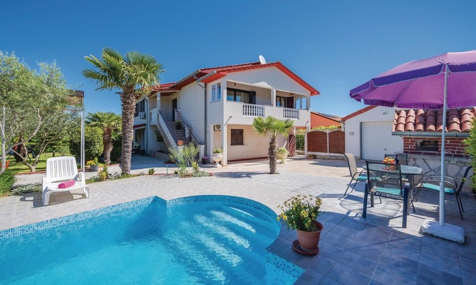 Rogocana House | This Mediterranean vacation home with pool and beautifully landscaped garden is located in a settlem