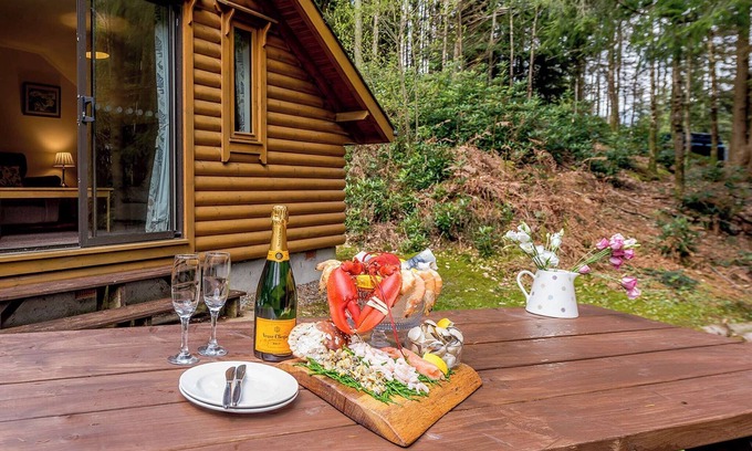 Westleigh Ski Chalet | Timber lodge set in an elevated position with views of the lake.
