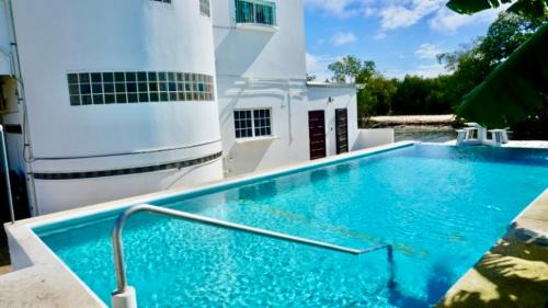Belize City Apartment | TRANQUIL Sea View Studio with Balcony, Infinity POOL, Overwater Deck & Kitchenette, 2nd Floor
