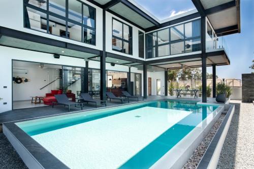 Ban Saiyuan Villa | Trendy Loft-style 4BR Pool Villa Sunset Garden 7