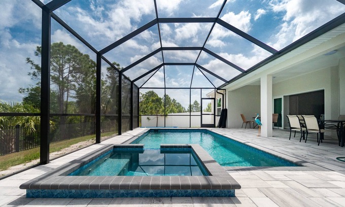 Englewood East House | Tropical Oasis with saltwater pool & hot tub on a canal 8 miles from beaches