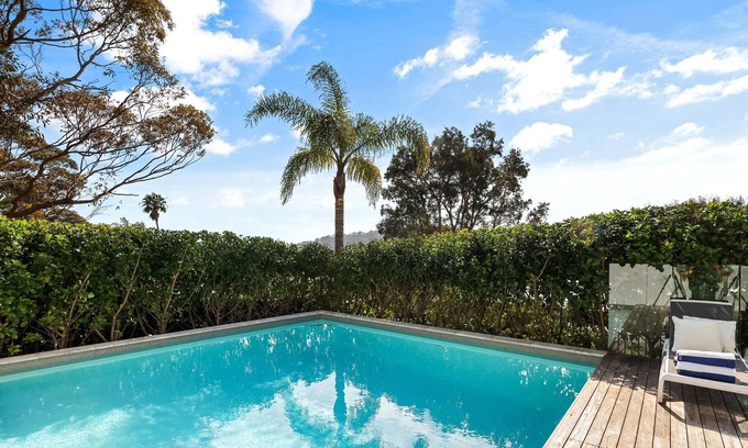 Newport House | Tropical outlook with heated pool close to beaches