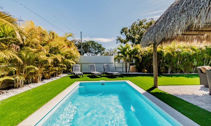 Madeira Beach House | Tropical Tiki Home 5 Mins to Beach -Pool, Private Putting Green