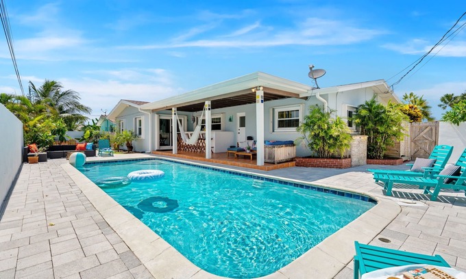 Seacoast Shores House | Tropical Retreat: Indian Harbour Beach Home with BBQ Grill, Fire Pit, Private Pool & Hot Tub! 🌴