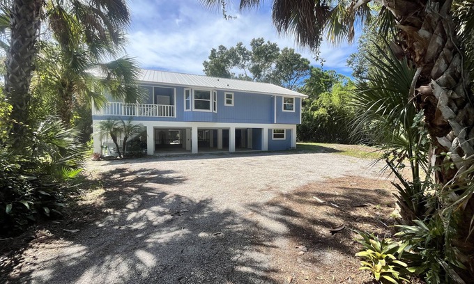Englewood House | Tucked Away on Wooded Way located blocks from Manasota Beach with Heated Pool.