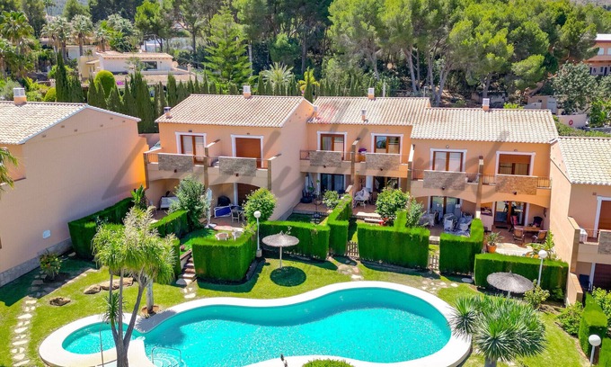 Denia Ski Chalet | Two bedroom terrace house with stunning communal pool and gardens