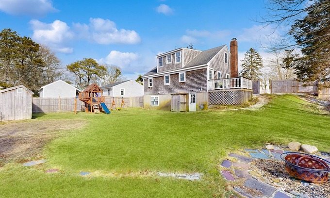 Harwich House | Two-story dog-friendly retreat with enclosed yard, playset, W/D, & firepit