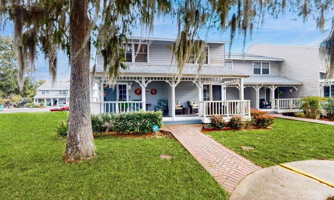 Inverness House | Two-story townhome with lake access, pool, bbq grill, screened patio