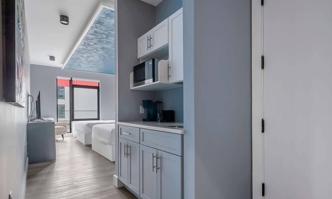 Mott Haven House | Upscale Double Queen Suite | Mott Haven | Fitness Center | Free WiFi