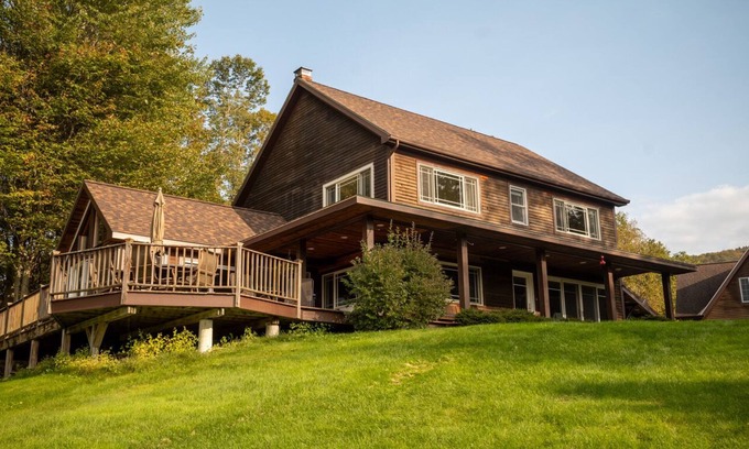 Waterbury House | Private hilltop home close to skiing. Enjoy views, hot tub & fire pit!