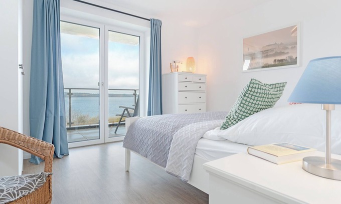 Bosau Apartment | Vacation apartment Maräne in Haus Seeblick with balcony and lake view in Bosau