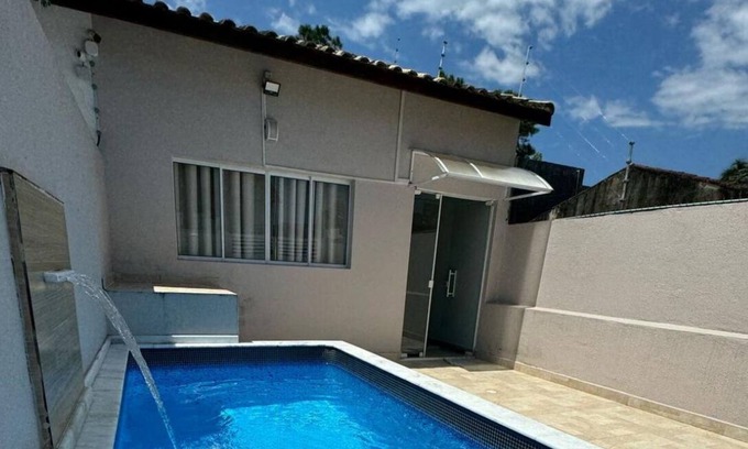 Raul Cury House | Vacation home in Itanhaém, a few minutes from the beach, with swimming pool and parking