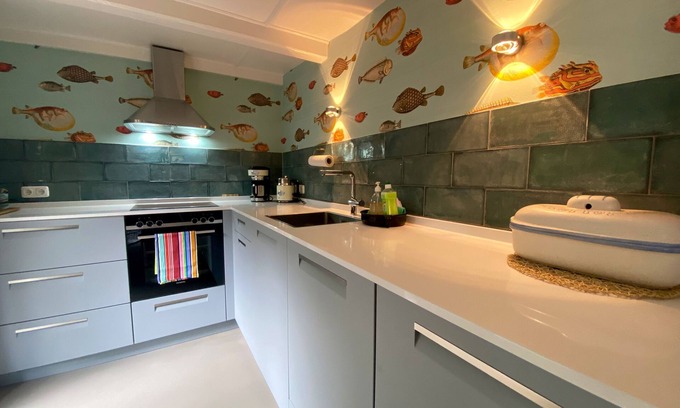 Presen House | Vacation home close to the beach with wood-burning stove, terrace