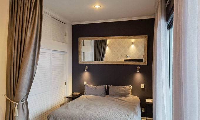 Auckland Central Business District Condo | Viaduct apartment with a balcony by Zodiak Stays