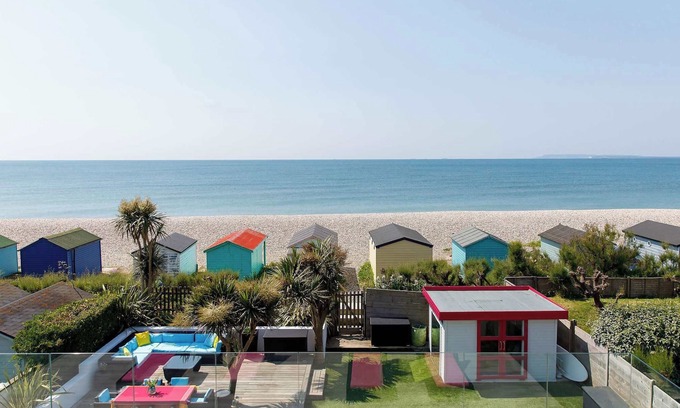East Wittering House | Vibrant Seafront Home With Seasonal Pool