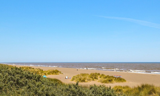 Anderby Creek Cottage | Views inland across the fields and only 100 yards to the unspoilt sandy beach at Anderby Creek.