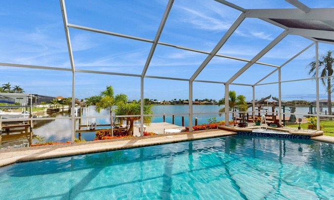 Eight Lakes House | Villa Aasta | Luxe Lakefront Outdoor Living | Screened Pool, Game Room & Dock