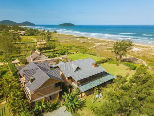 Barra de Ibiraquera House | Villa Bali Casas pé na areia