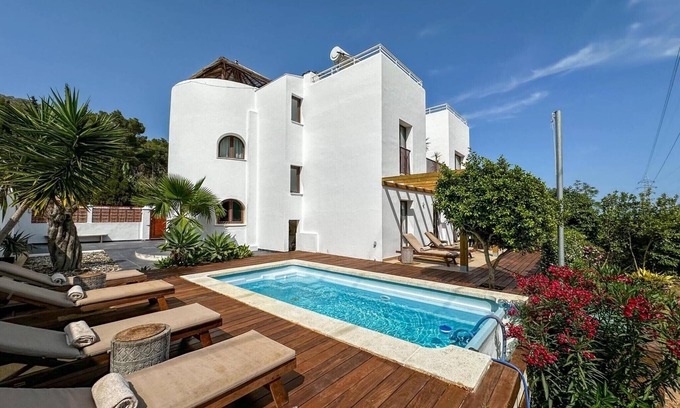 Santa Eulalia del Rio Villa | Villa 'Dorada' with Sea Views, Wi-Fi and Air Conditioning