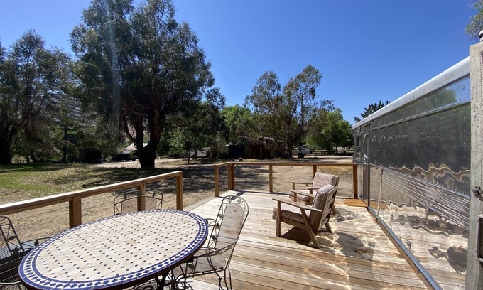 Kernville House | Vintage wood paneled travel trailer on Kernville Ranch: horses, river, hot tub