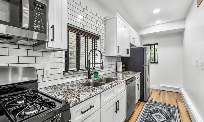 Holly Apartment | Walk to downtown Holly from this newly renovated historic apartment!