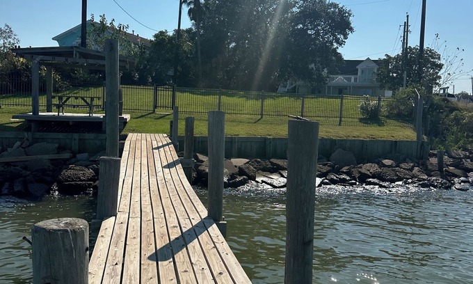 Bacliff House | Watch amazing sunsets from the 6 person hot tub & private 220’ pier.