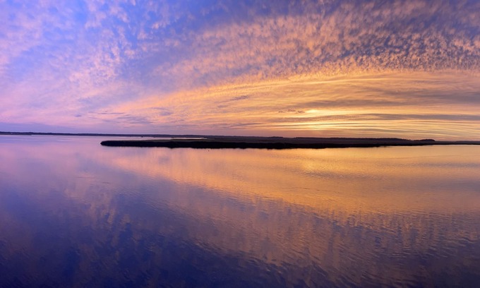 Northside RV Rental | Waterfront campsite, a serene oasis for nature lovers and fishing enthusiasts! n