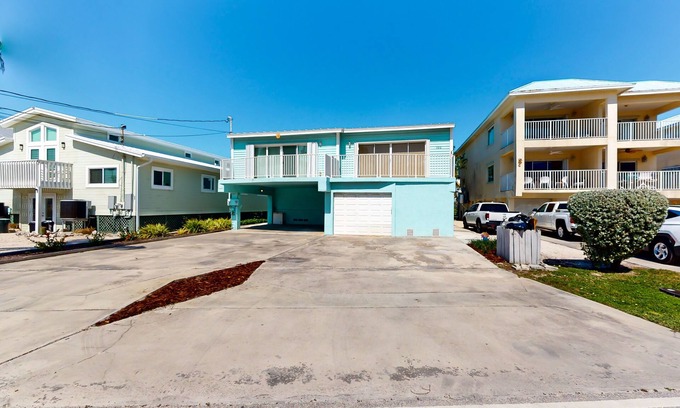 Key Colony Beach House | Waterfront duplex with canal access & Cabana Club pool membership