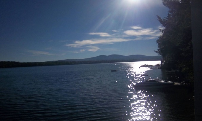 Laconia House | WATERFRONT HOME BOAT HOUSE BOAT SLIPS PANORAMIC LAKE AND GUNSTOCK MOUNTAIN VIEW
