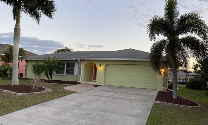 Edgewater House | Waterfront house, boat dock, pool, walking distance to Port Charlotte Beach
