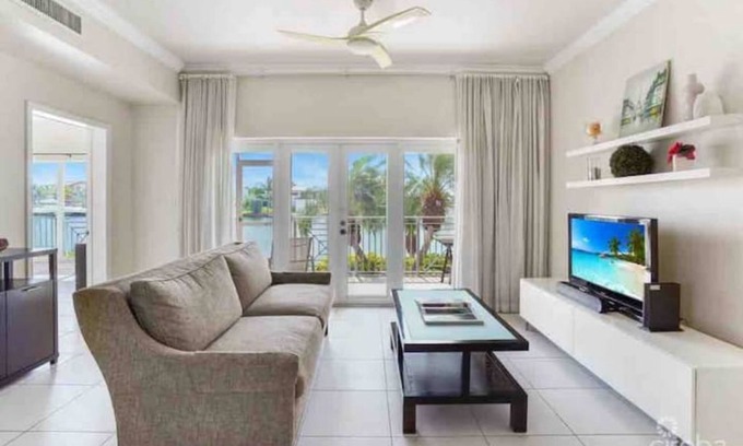 Grand Harbour Condo | Waterfront Sanctuary Cove, 2Bed 2Bath, King Bed, Pool, Porch at Grand Harbour.