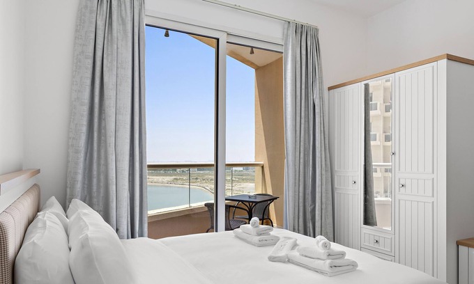 Dubai Production City Apartment | WelHome - Lovely Studio Apartment in Production City